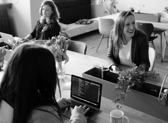 Three people working in an office